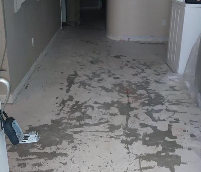 A photo of a hallway with no flooring.