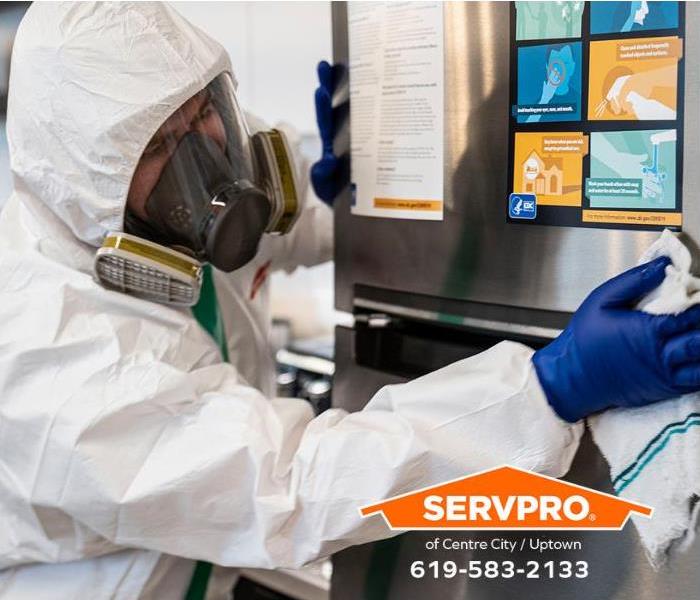 SERVPRO technicians decontaminate a breakroom in a workplace.