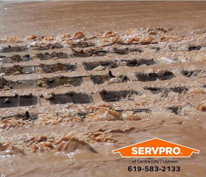 A clogged storm drain is shown.