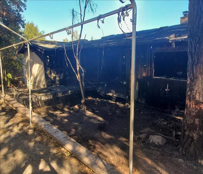 The outside of a San Diego home that experienced a large fire on the property